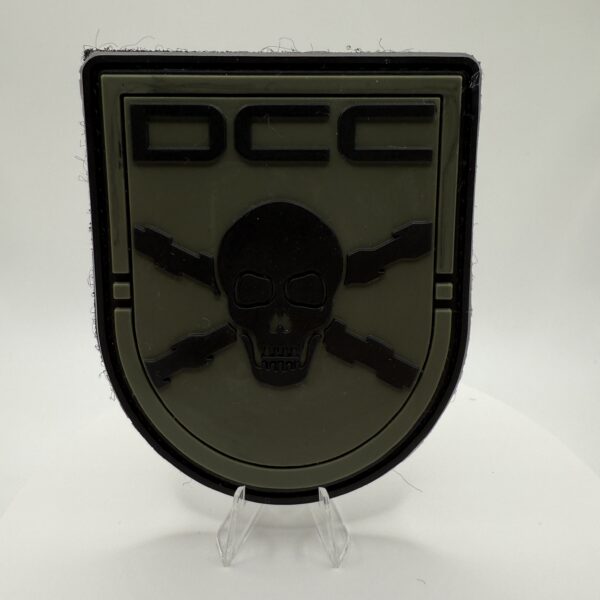 PARCHE PVC "DCC LEGION ESPAÑOLA" - DEFENSA CONTRA CARRO (COLOR VERDE)
